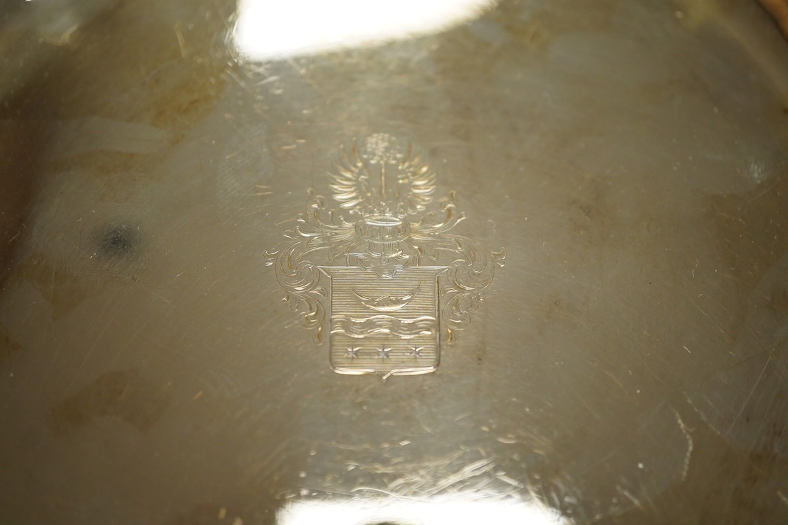 A German 800 standard white metal salver, diameter 35.9cm, together with a similar waiter, diameter 15.6cm, both with engraved armorial, 35oz.